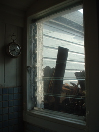 Roofing piled outside our kitchen window