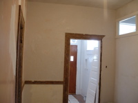 second wall completed plaster, looking into entry foyer