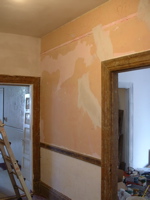 looking towards kitchen and living room, with last wall to be plastered on the right